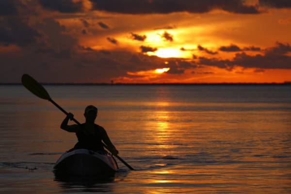 A man kayaks on the Gulf